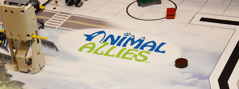 Das Logo von Animal Allies umgeben von Bauten aus Legoteilen